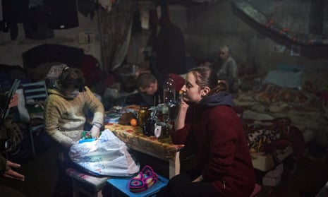 Anna sits with her daughter Nastya, left, in a basement as Russian attacks continue nearby, in Soledar, Donetsk region, Ukraine.