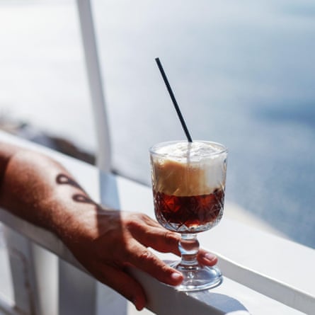 Frappe cold coffee in a hand on Santorini.