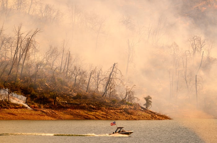 Nearly 30,000 people in northern California evacuated as raging wildfire spreads | California | The Guardian