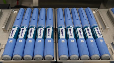 Ozempic pens sit on a production line