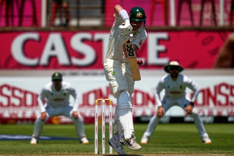 Matt Renshaw plays a high ball as South AfricaâÂÂs fielders look on