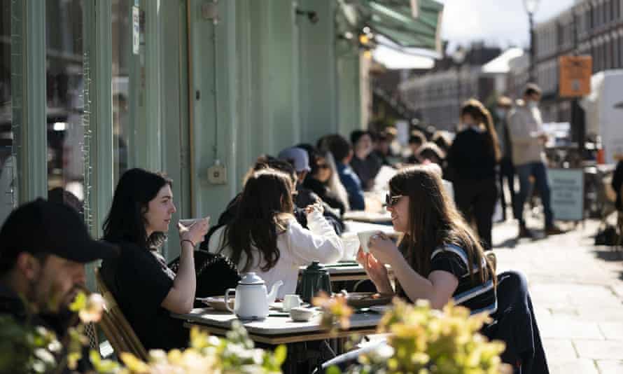 People seated outside restaurant