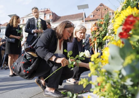 The mayor and vice-mayor of Graz laying flowers in the city’s central square.