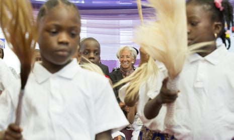 Christine Lagarde watches children perform a dance at an orphanage in Abuja during her visit to Nigeria