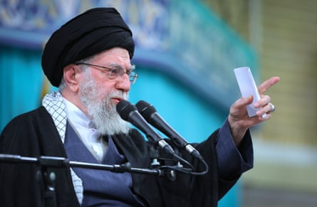 Ali Khamenei speaks into a microphone
