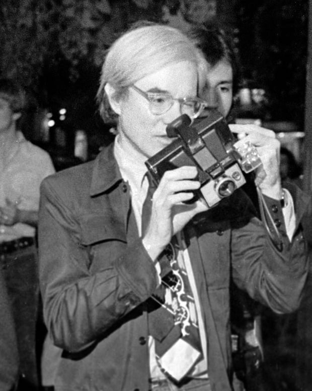 Andy Warhol with Polaroid camera in1973.