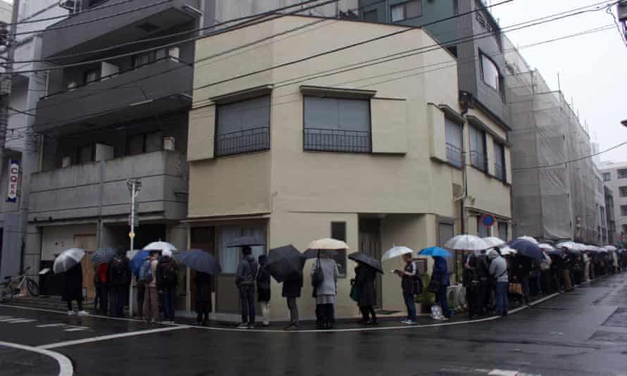 People queue around the block waiting to be seated at Tsuta.