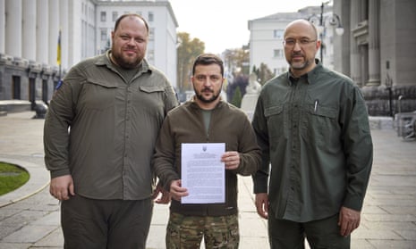 Zelenskiy holds a letter