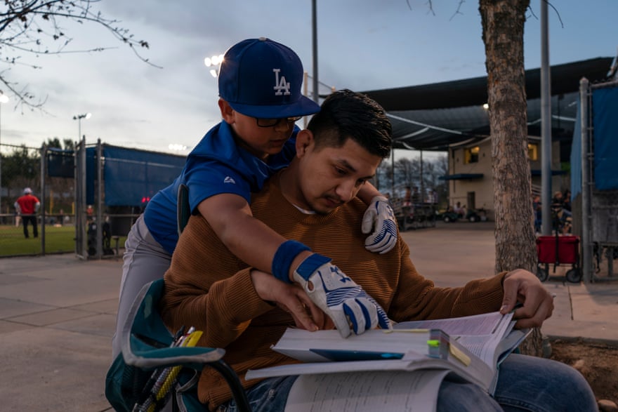 Miguel studies for his mid-term exams at his younger brother’s baseball game in Clovis, California.
