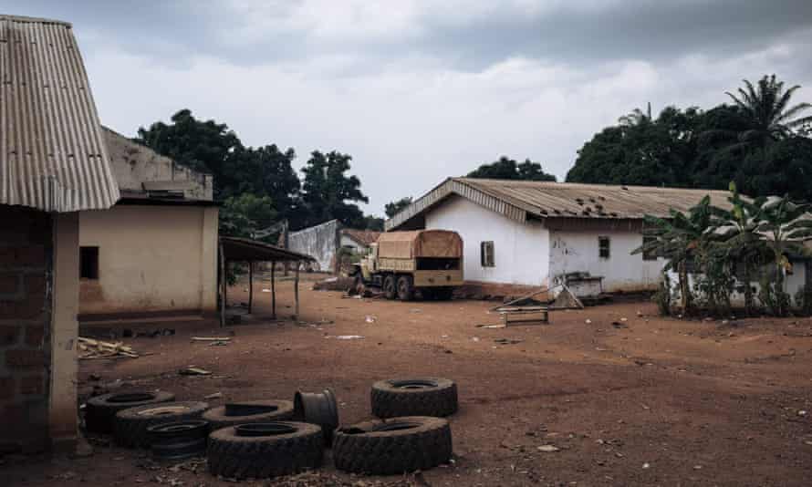 Truck parked outside hut