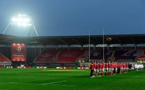 The players line up for the anthems.