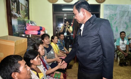 The Thai prime minister, Prayut Chan-o-cha, meets some of the trapped boys’ family members