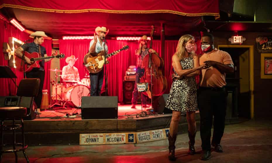 Lloyd Weatherspoon and Hope Wilson dance in masks at The White Horse on 10 March 2021 in Austin, Texas. 
