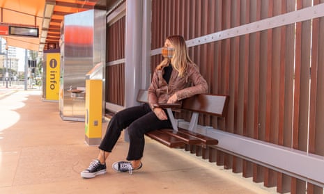 Woman in mask at train station