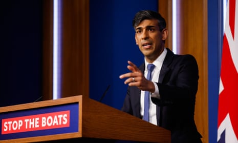 Rishi Sunak in front a lectern which reads 'Stop the Boats'