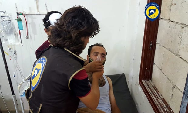 A rescue worker treats a man in Saraqeb, Idlib, said to be affected by a chlorine gas canister attack 