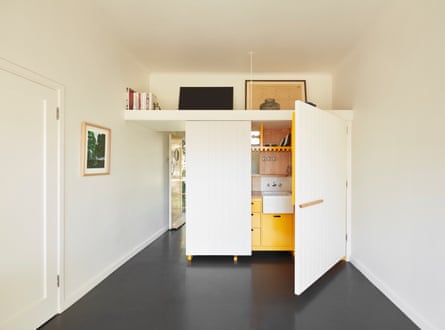 A cupboard door opening shows a glimpse of a kitchen