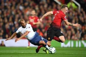Lucas Moura goes down after a challenge by Phil Jones.