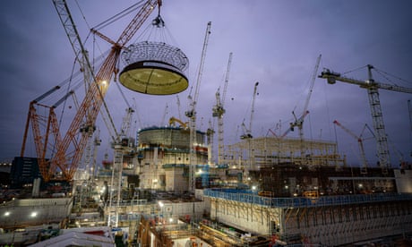 Engineering teams use the world's largest crane – Big Carl – to lift a 245-tonne steel dome on to Hinkley Point C's first reactor building in the UK