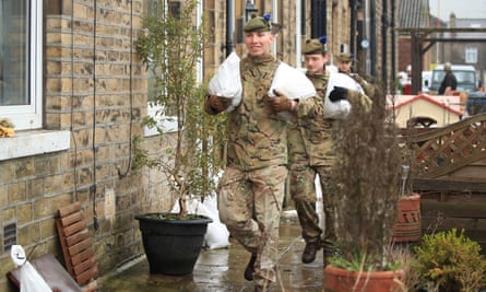 Soldiers from the Highlanders, 4th Battalion, the Royal Regiment of Scotland in Mytholmroyd assisting with flood defences, in the Upper Calder Valley in West Yorkshire.
