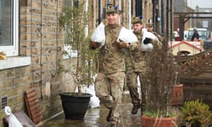 Soldiers from the Highlanders, 4th Battalion, the Royal Regiment of Scotland in Mytholmroyd assisting with flood defences, in the Upper Calder Valley in West Yorkshire.