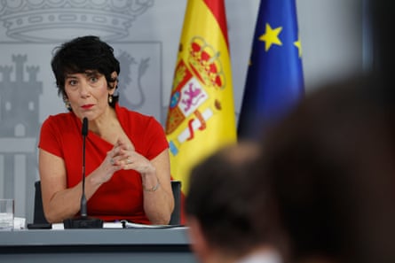 a woman in front of a microphone