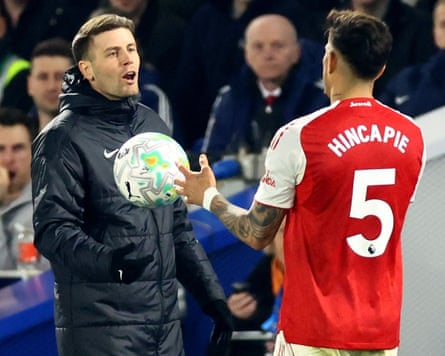 Fabian Hürzeler and Piero Hincapié share words during the Premier League match between Brighton and Arsenal