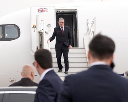 Starmer disembarking a plane