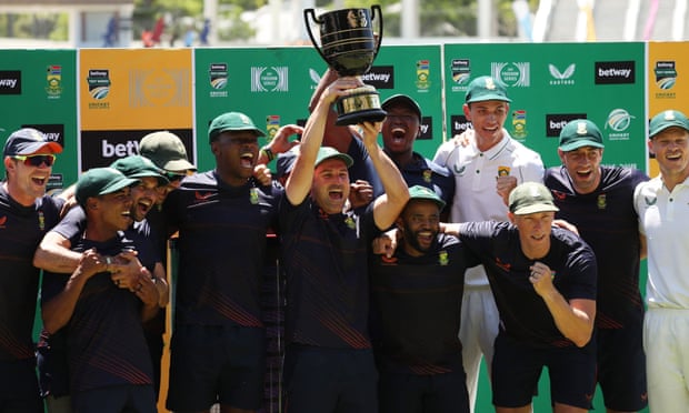 South Africa's Dean Elgar holds the trophy aloft after beating India in the Test series.