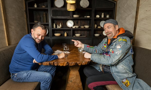 Comedians Geoff Norcott and Rufus Hound chatting at a table at Hide restaurant in London
