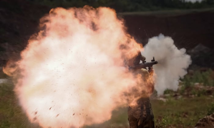 A Ukrainian serviceman fires a rocket-propelled grenade (RPG) launcher as part of a training exercise not far from front line in Donbas, Ukraine.