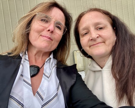 Two women look at the camera