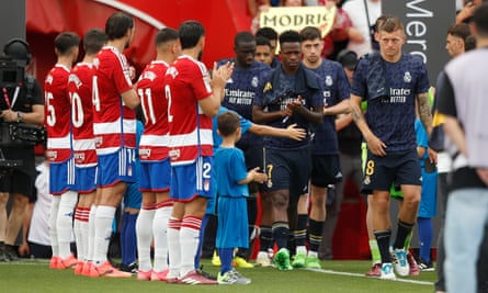 Granada pay tribute to Real Madrid’s La Liga champions before the match.
