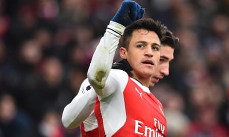 Arsenal’s Alexis Sánchez celebrates his opening goal against Hull – with his dirty shirt showing where the ball struck his elbow.