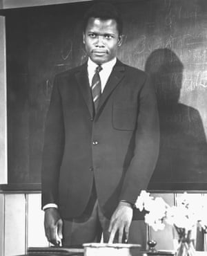 Sidney Poitier in the 1967 British classic To Sir With LovePoitier wears the Ivy look uniform of patch pocket blazer, flannel trousers, military style tie and button down shirt.