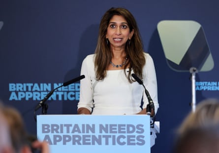 Braverman stands at lectern with ‘Britain needs apprenticeships’ written on it in capitals
