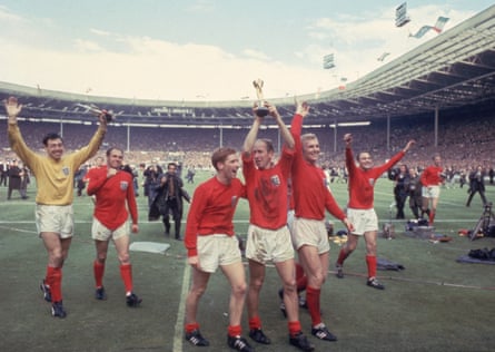Bobby Charlton raises the Jules Rimet trophy in the air after the 1966 final at Wembley