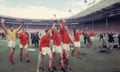Bobby Charlton lifts the Jules Rimet trophy at Wembley after England’s triumph in 1966