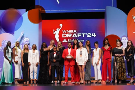 The 2024 WNBA draft class poses for picture with Jake From State Farm on Monday night at the Brooklyn Academy of Music.
