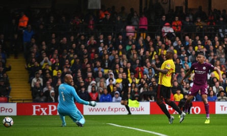 Gabriel Jesus scores his side’s third goal past the Watford goalkeeper Heurelho Gomes.