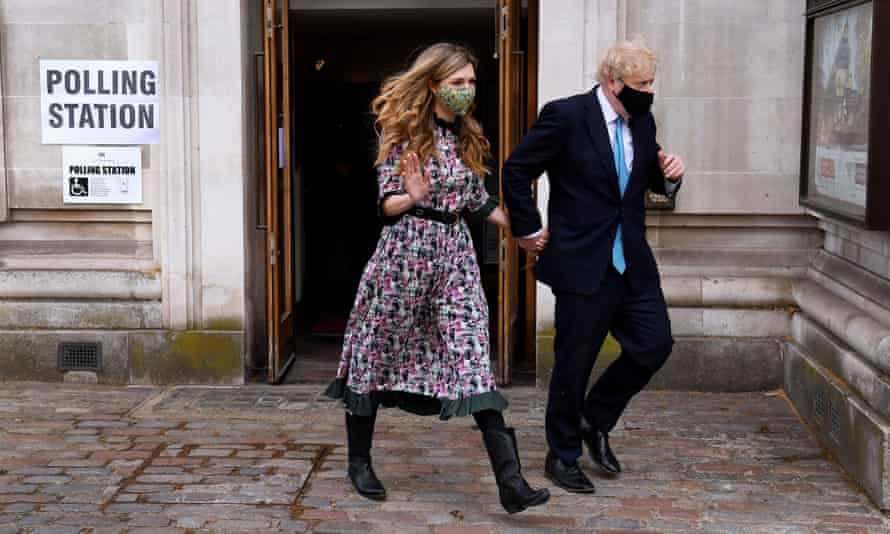 Boris Johnson and his partner, Carrie Symonds, visit Methodist Central Hall in Westminster to cast their votes.