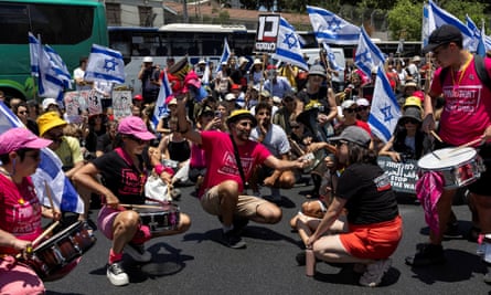 Protesters block a road junction in Tel Aviv