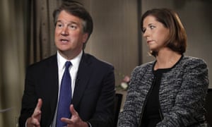 Brett Kavanaugh, with his wife Ashley Estes Kavanaugh, answers questions during a Fox News interview Monday.