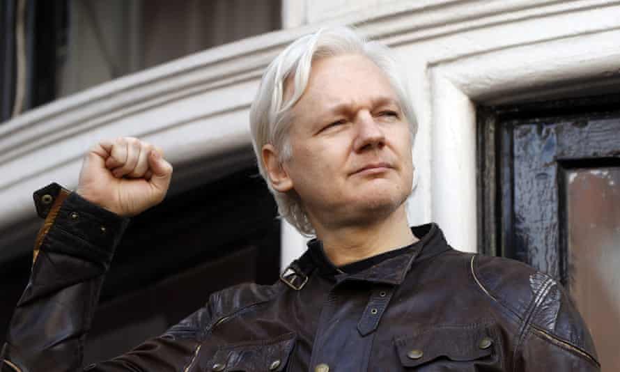 Julian Assange greets his supporters in front of the Ecuadorian embassy in London in 2017.