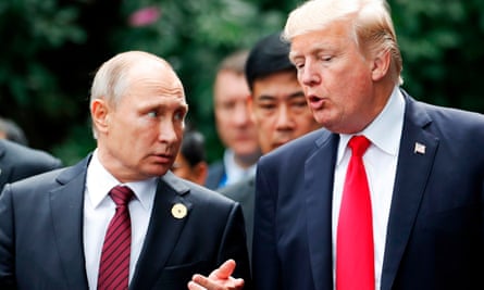 Donald Trump and Vladimir Putin talk during the Asia-Pacific Economic Cooperation leaders’ summit in the central Vietnamese city of Danang last year.