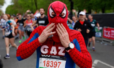 Gareth Davies dressed as Spider-Man poses during the marathon