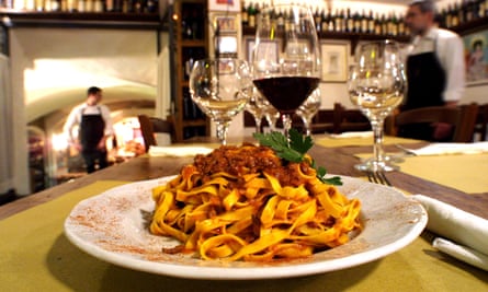 Close up of a plate of tagliatelle al ragu at a restaurant in the Emilia-Romagna region of Italy.