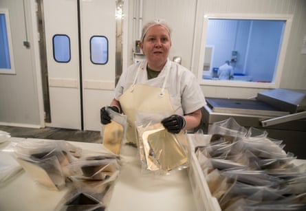 A worker packs filleted toothfish into plastic bags at a Falkland Islands processing factory