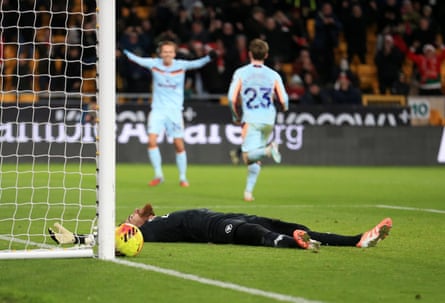 José Sá lays on the pitch in front of goal