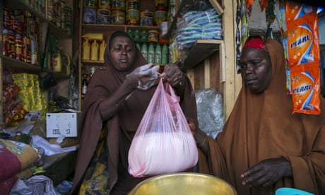 Shopping for flour in a Mogadishu market, where the price of wheat has shot up 45% as a result of the war in Ukraine.